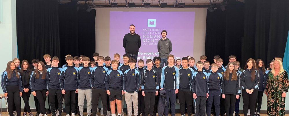 <p><strong>Michael Boyd and Jason McKeown from the Northern Ireland Human Rights Commission with Year 11 students from Bangor Academy.</strong></p>
